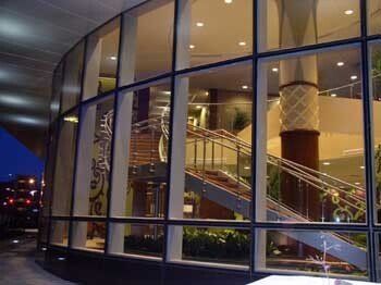 Steel stair with custom glass railing system