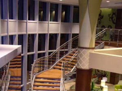 A staircase in a building with a lot of windows