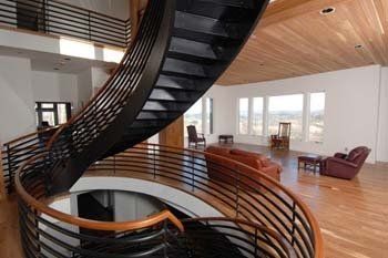 There is a spiral staircase in the middle of the room.
