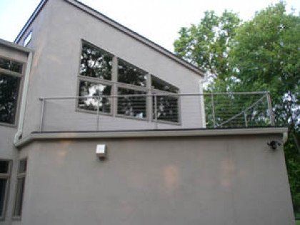 A house with a balcony on the side of it