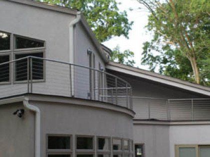 A house with a balcony on the side of it