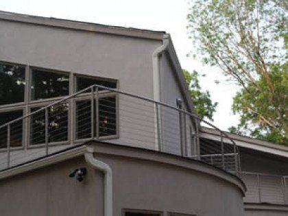 A house with a balcony on the side of it