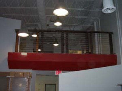 There is a red balcony in the middle of the room.