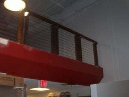 A restaurant with a red ceiling and a red exit sign.