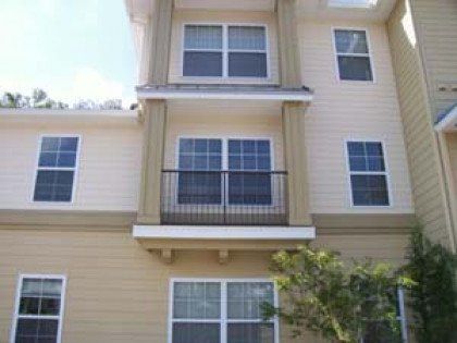 A building with a balcony and lots of windows