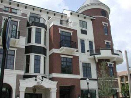 A large brick building with a tower on top of it.