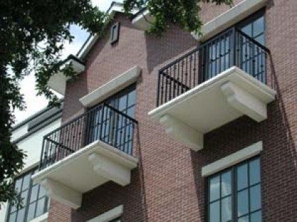 A brick building with balconies on the side of it
