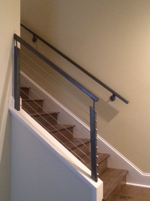 A set of stairs with a metal railing