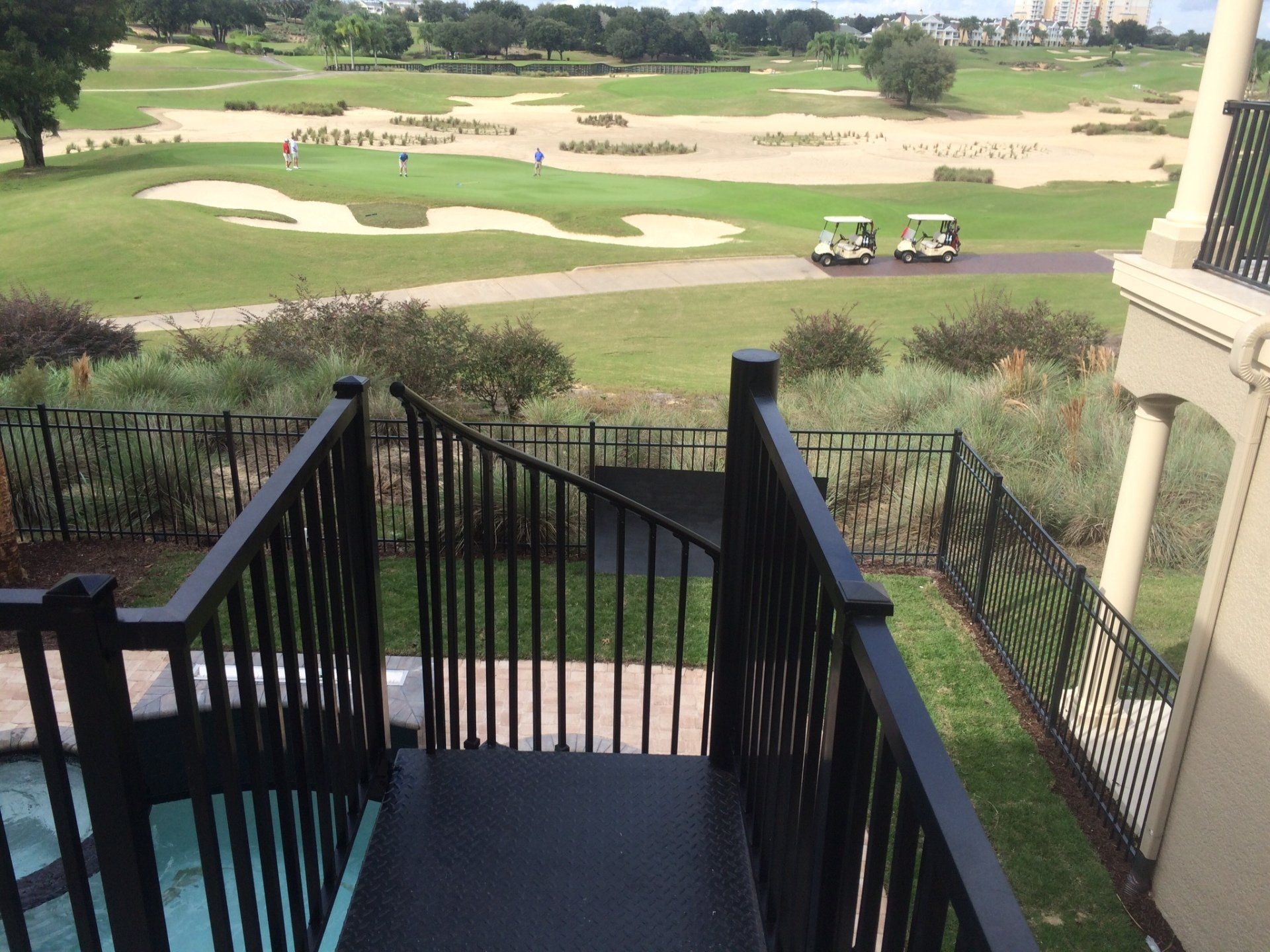 A view of a golf course from a balcony