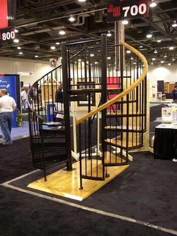 A spiral staircase is on display at a trade show