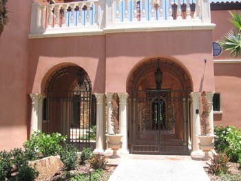 The front of a building with arches and columns