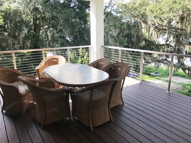 A deck with a table and chairs on it