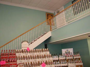 A store with a staircase leading up to the second floor