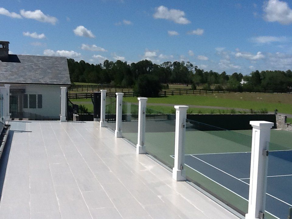 A view of a tennis court from a balcony