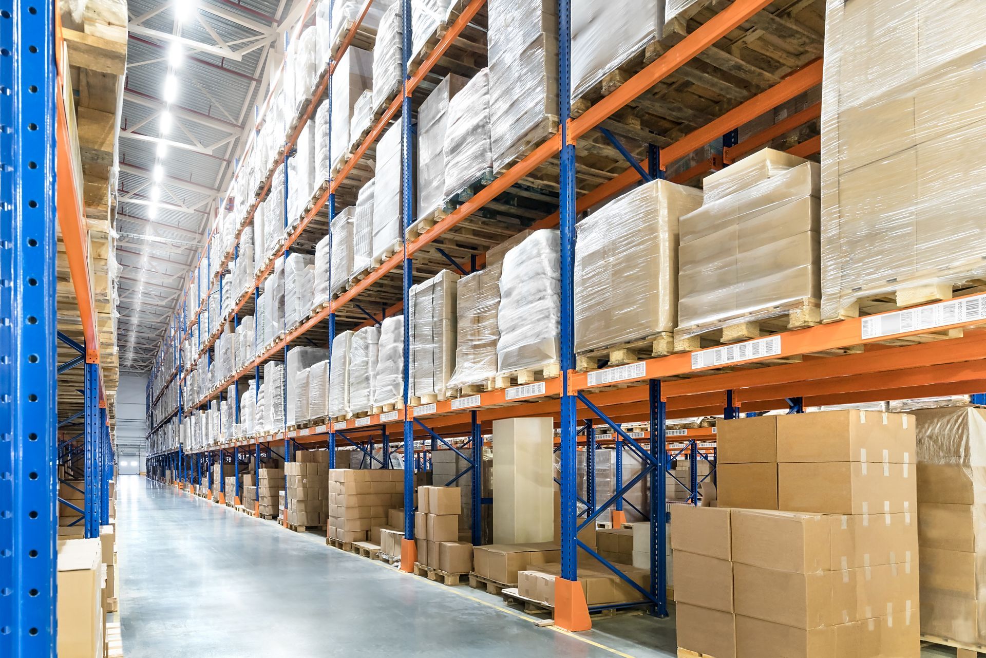 Warehouse Interior With Tall Shelving Packed — Australian Asset Compliance in Brisbane, QLD