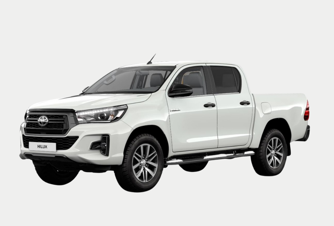 A white toyota hilux pickup truck is shown on a white background.