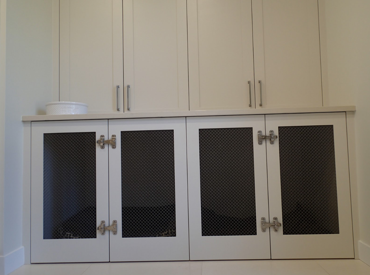 White cabinets with metal mesh doors and upper cabinets.