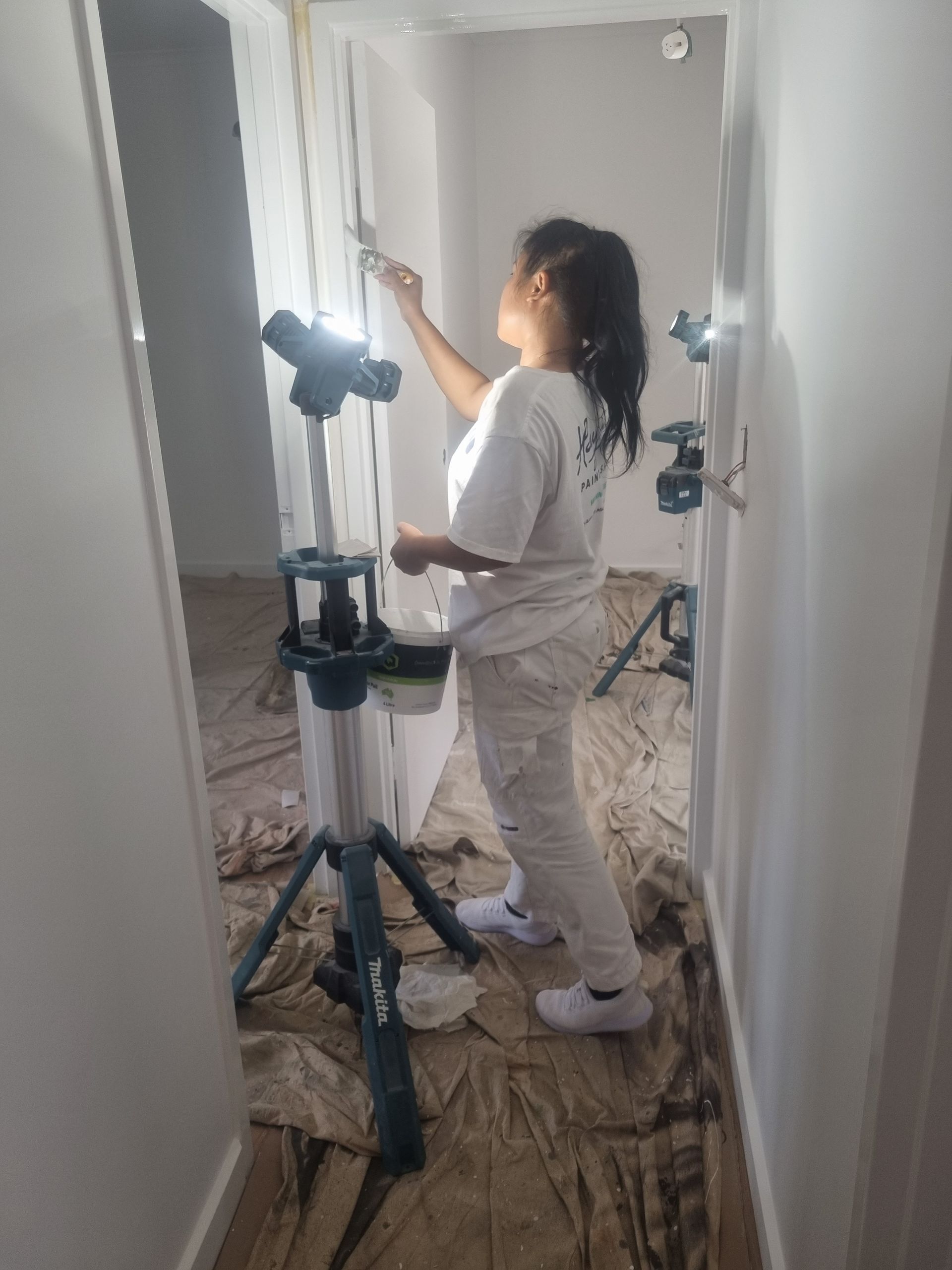 A Painter Is Painting A Doorway White — Ross Painting In Ciccone, NT