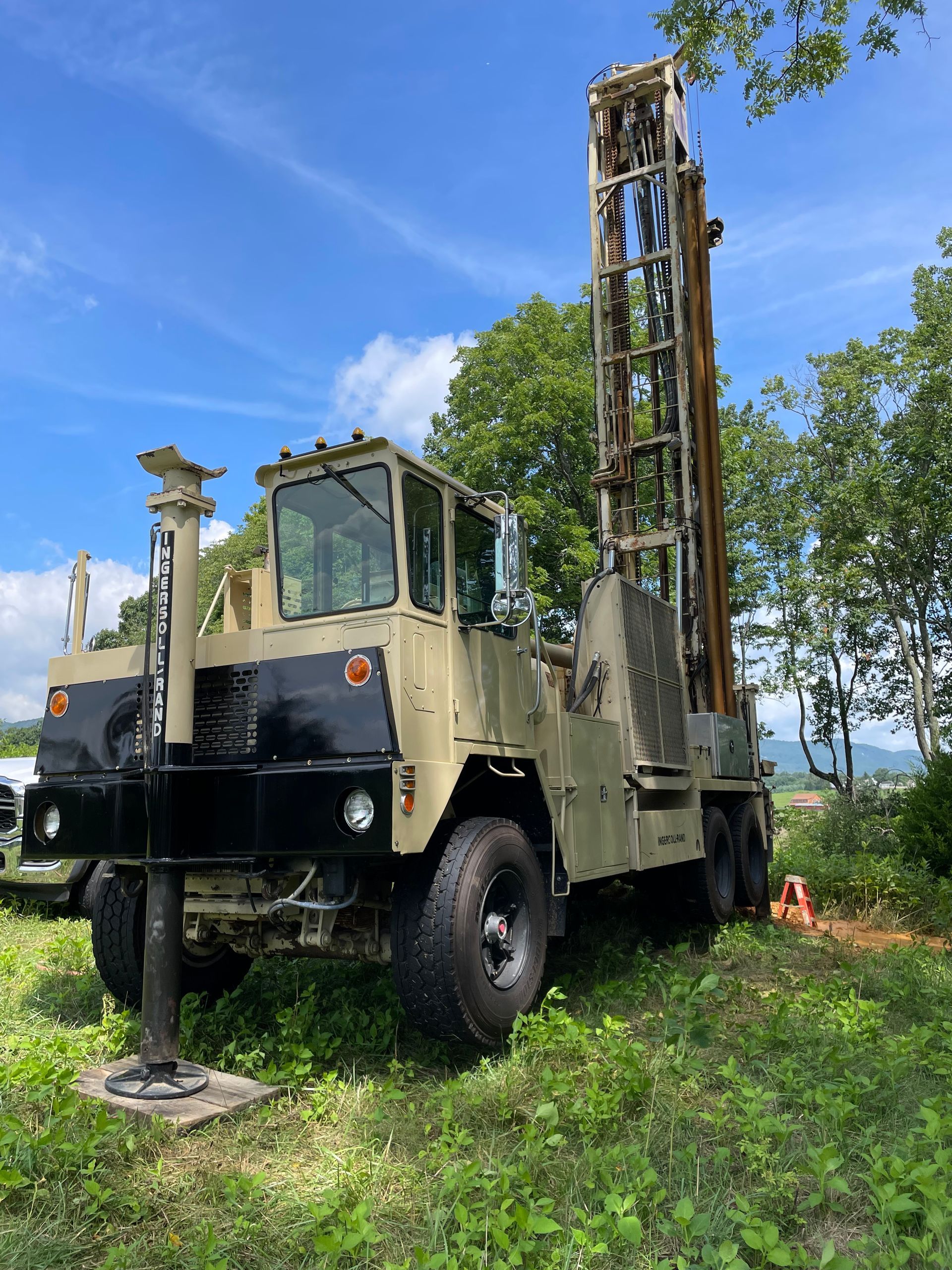 Large Truck Parked in a Grassy Field | Buchanan, VA | Lester Well Drilling Inc