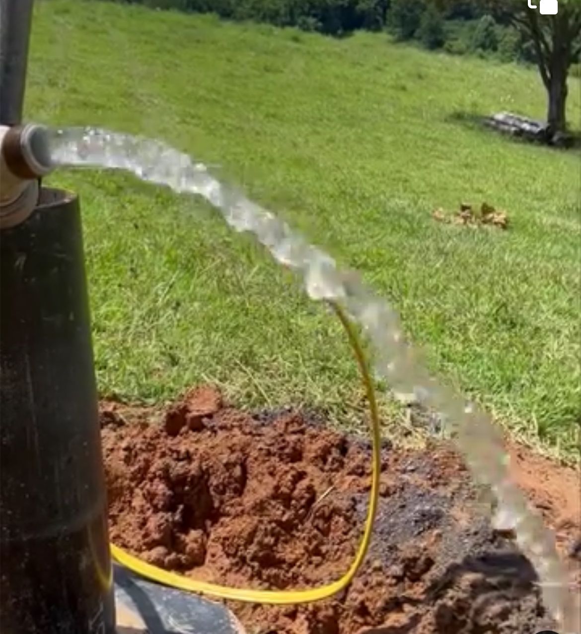 A Hose Connected to a Pipe and Water is Coming Out of it | Buchanan, VA | Lester Well Drilling Inc