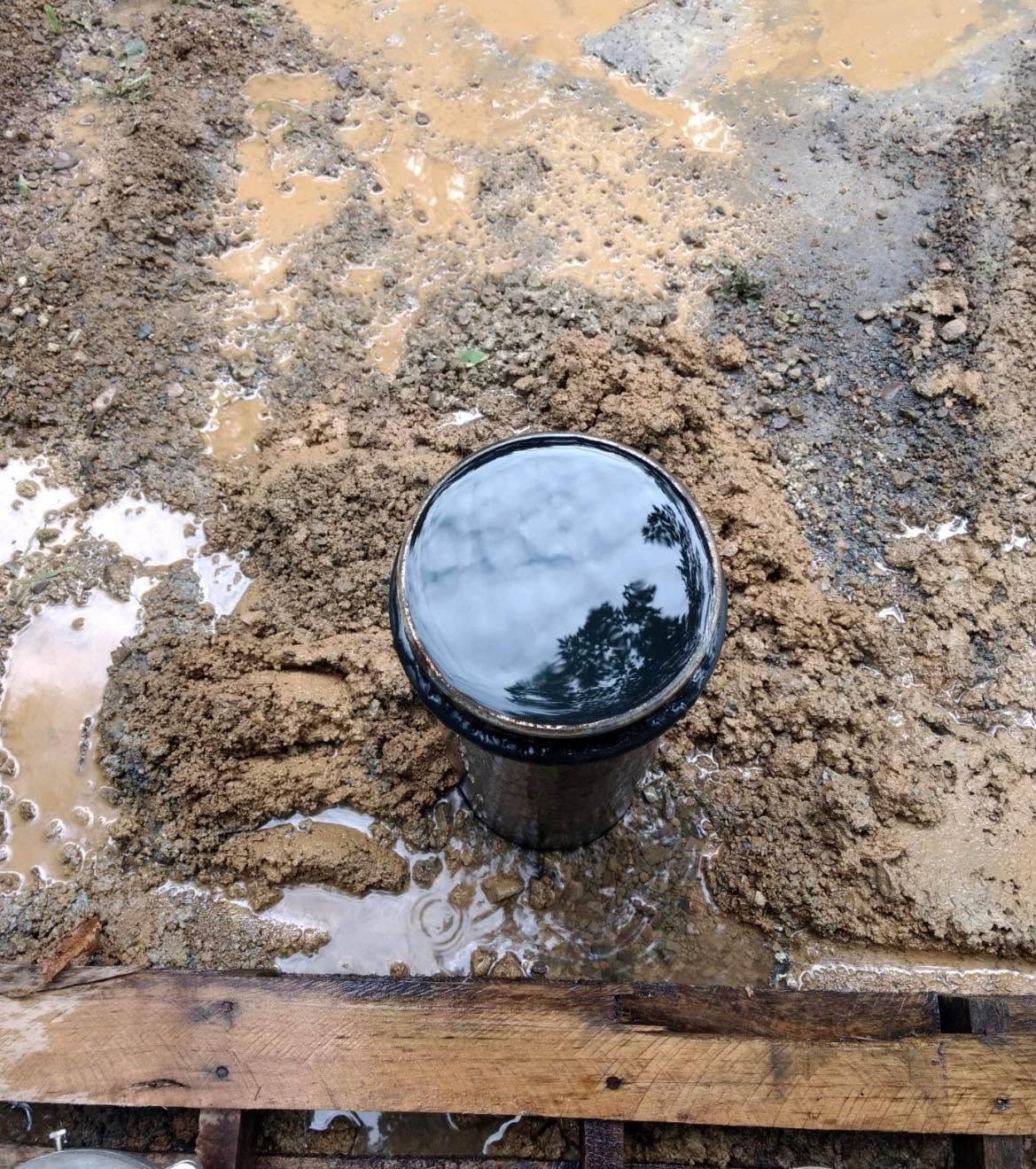 Muddy Pipe Sitting on Top of a Wooden Pallet | Buchanan, VA | Lester Well Drilling Inc