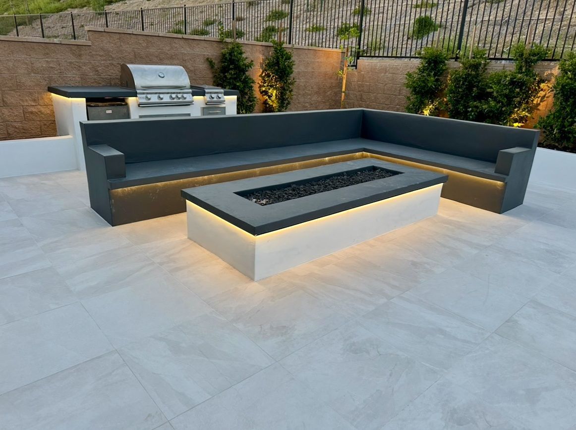 A white house with a table and chairs in front of it