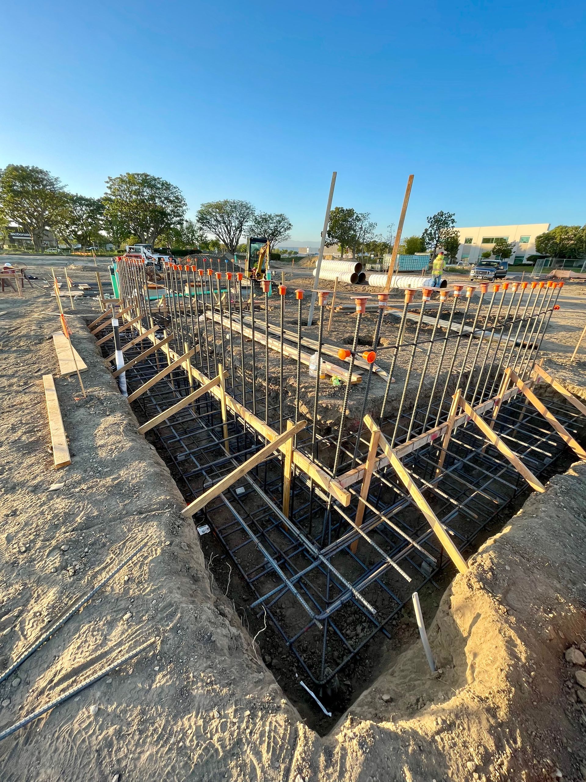 A group of construction workers are working on a construction site.