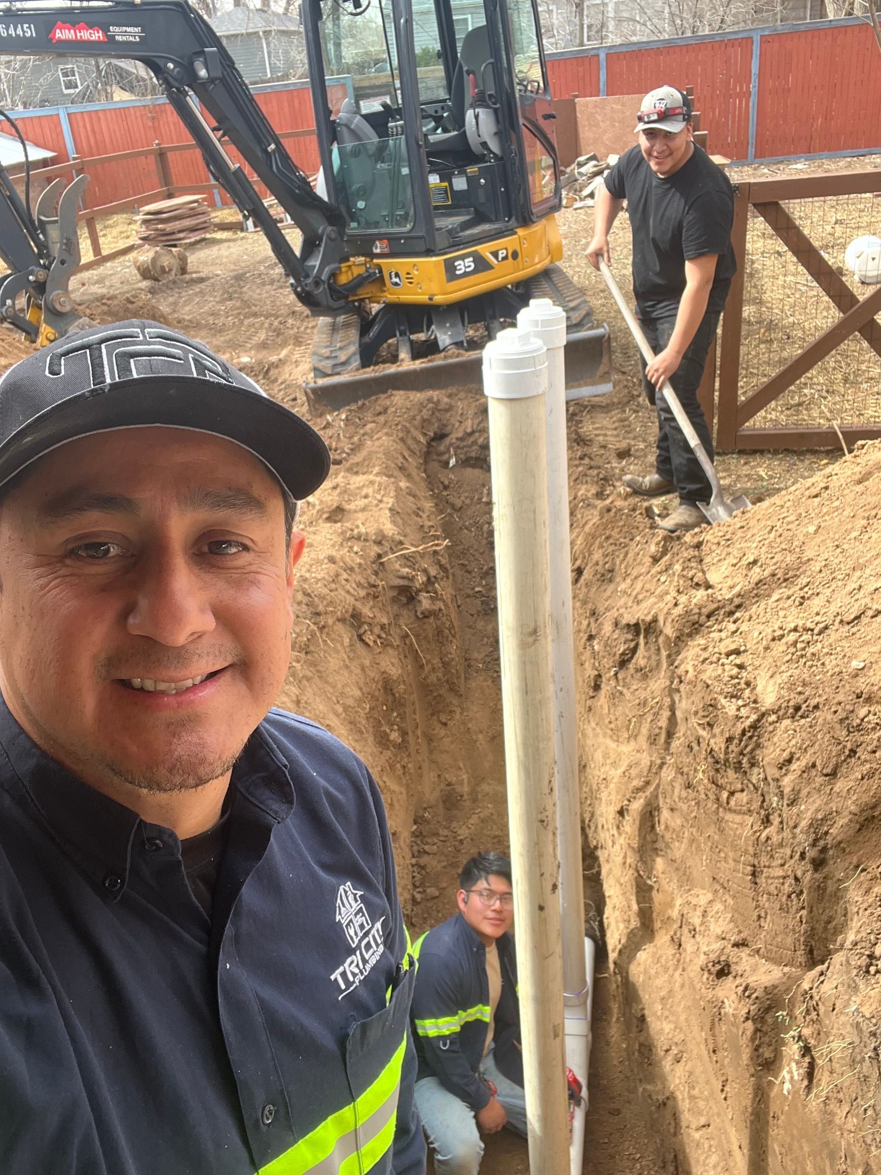 a person is fixing a sink pipe with a pair of pliers