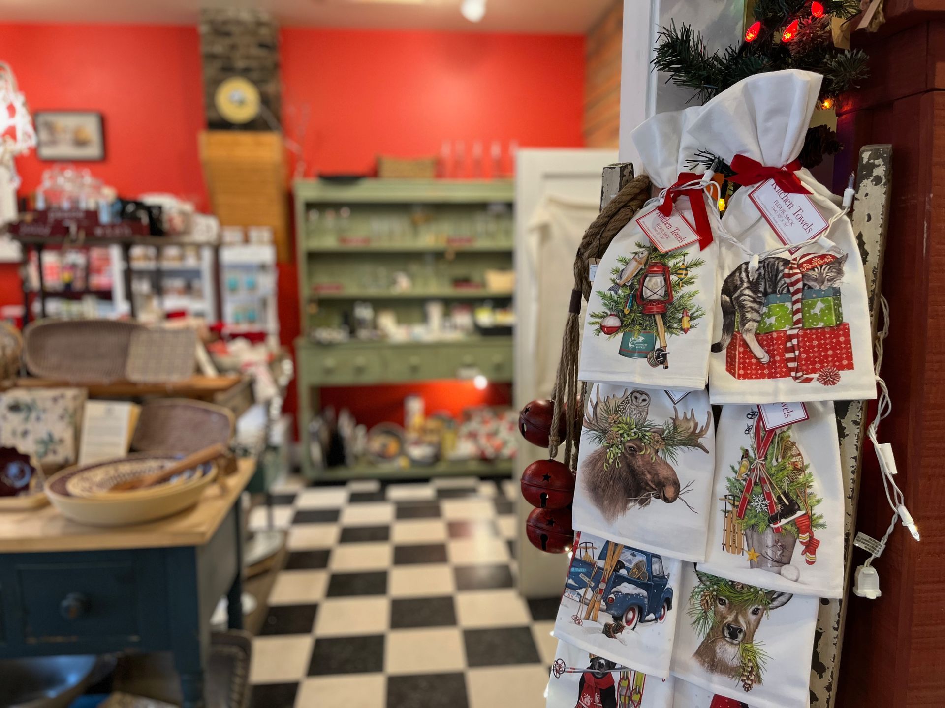 A christmas store with a checkered floor and a clock on the wall.