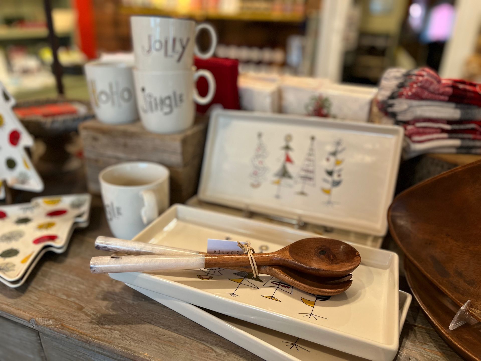 A tray with a wooden spoon and fork on it