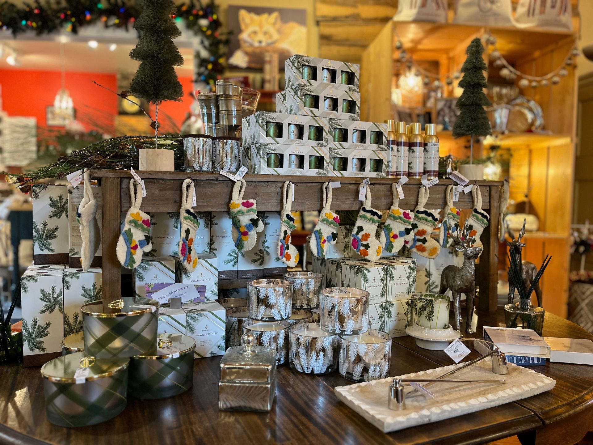 A table with a lot of christmas decorations on it.