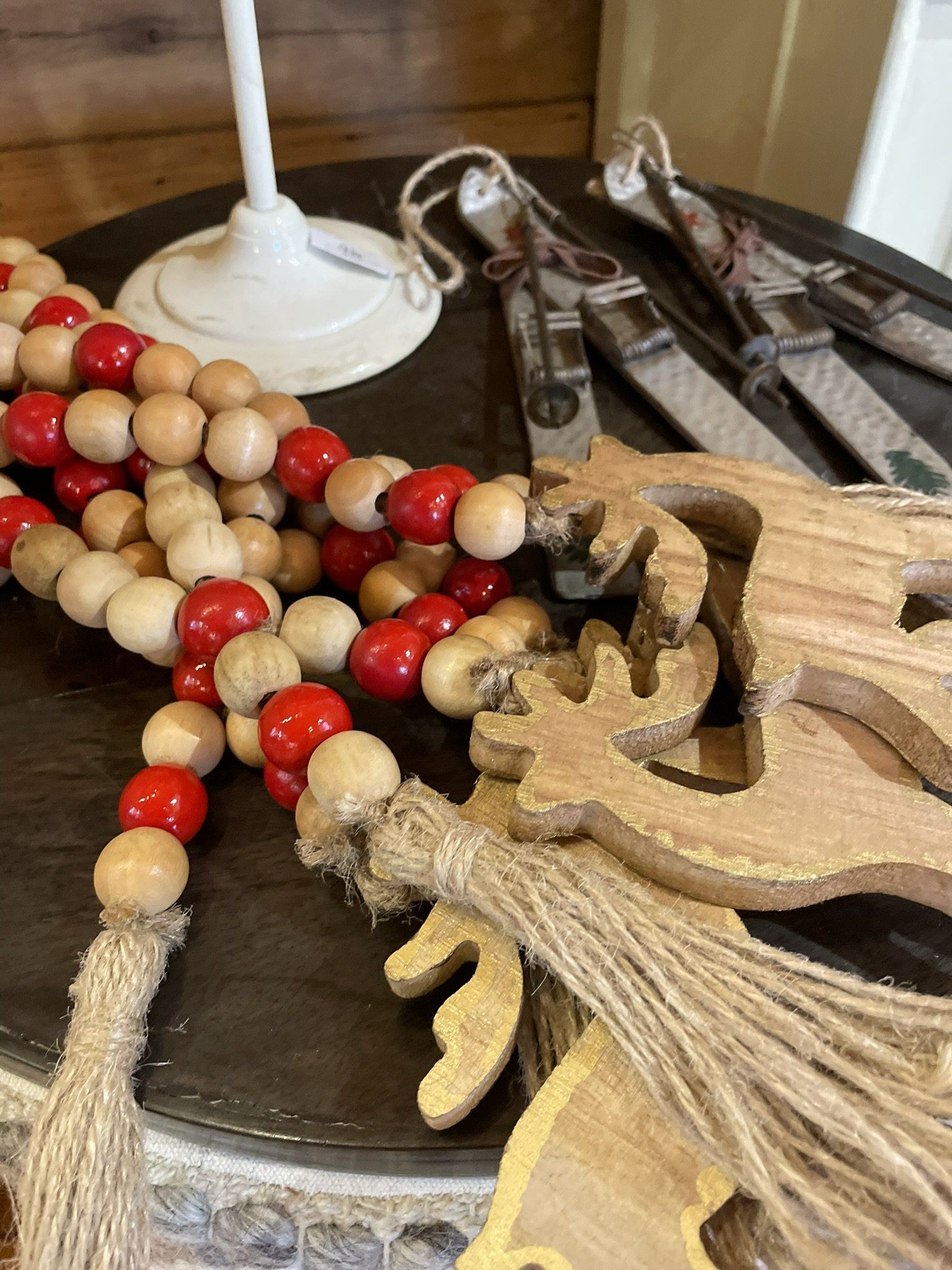 A bunch of wooden beads are sitting on a table.