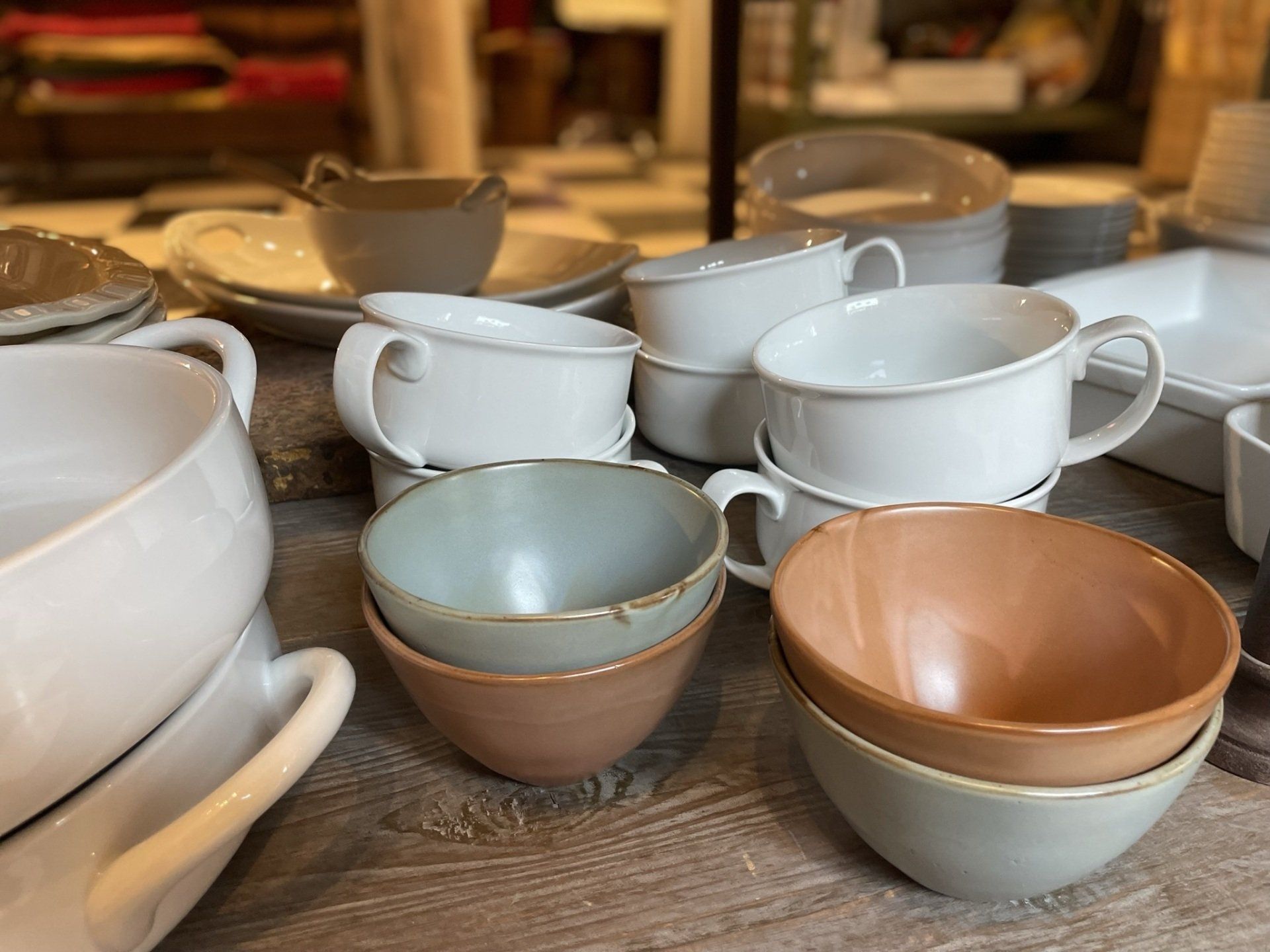 A table topped with a variety of bowls and plates.