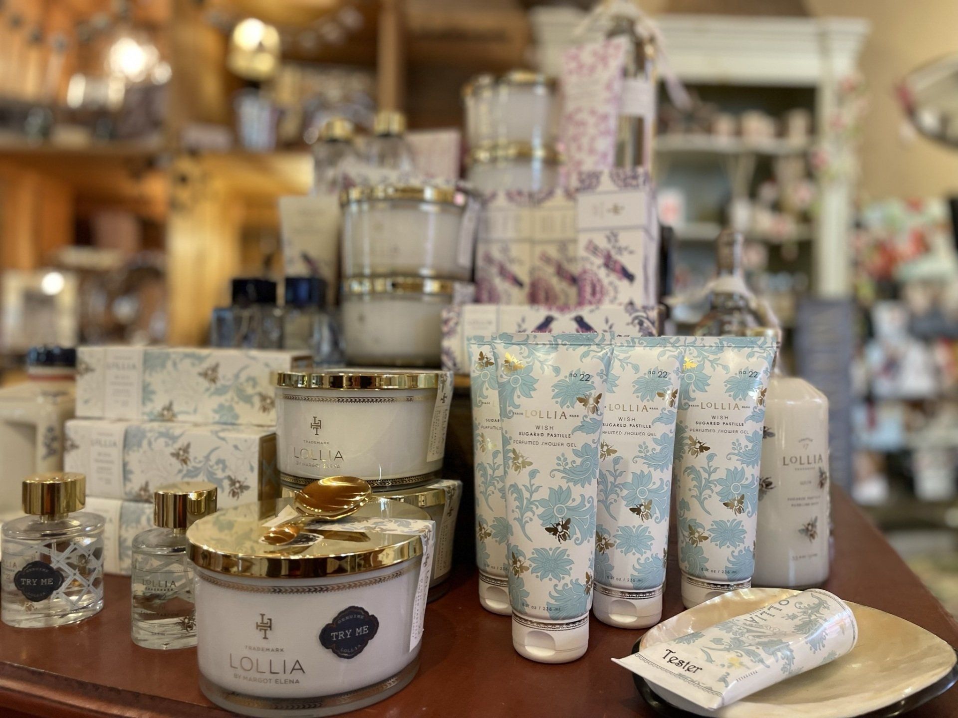 A table topped with candles , lotion , and soap.