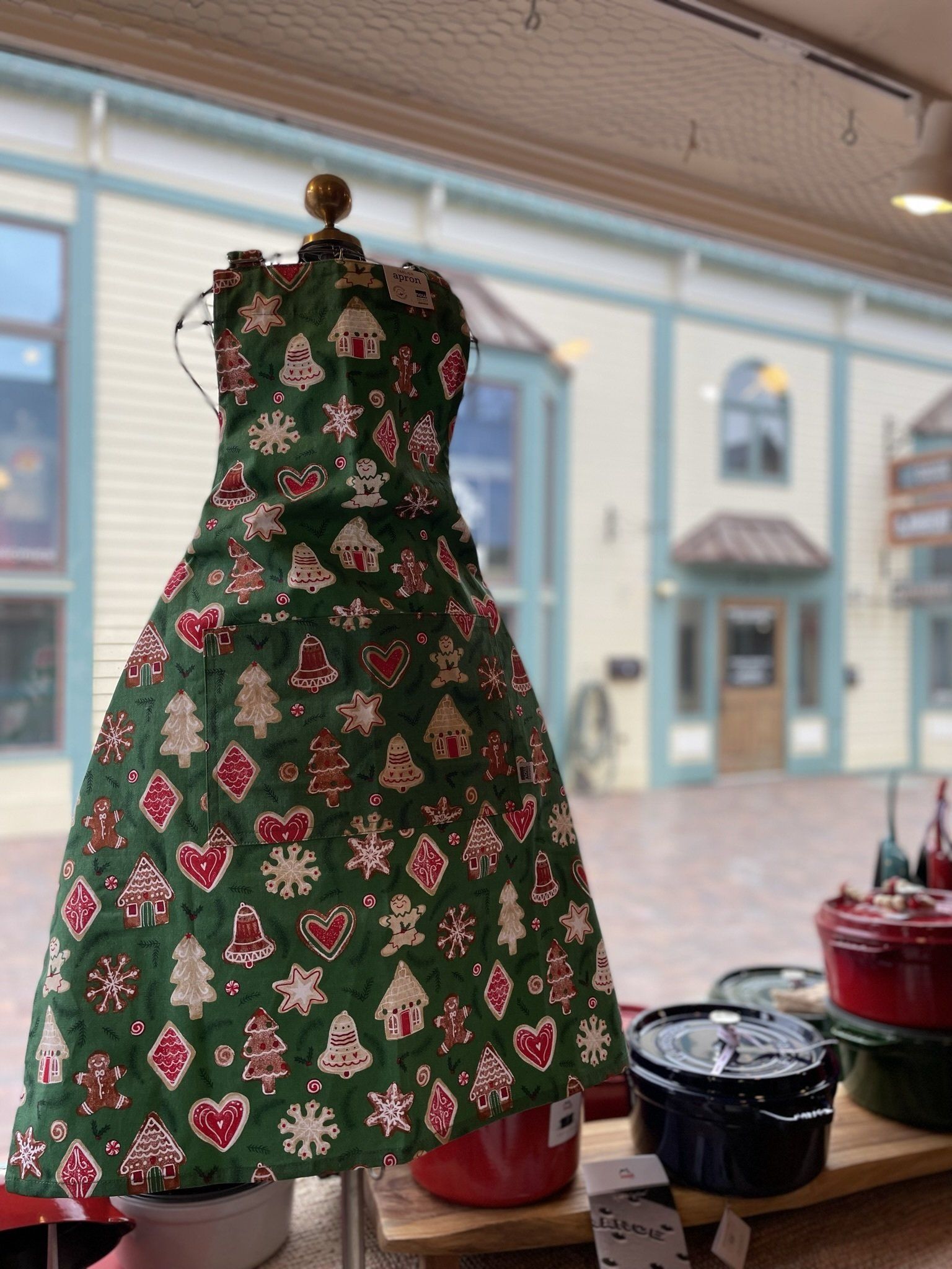 A green dress with christmas trees and hearts on it