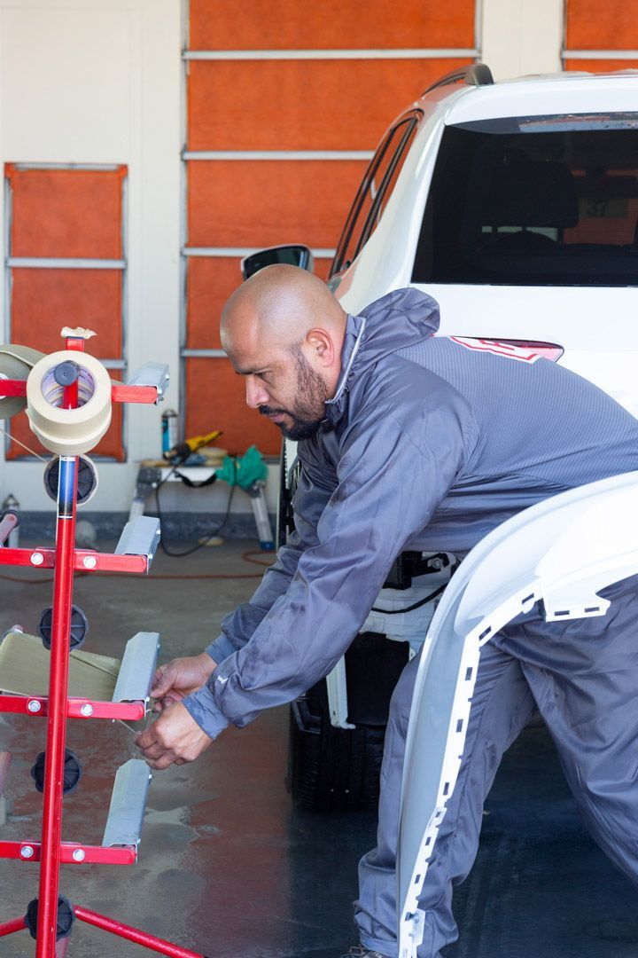 Mechanic Working on a Vehicle | University Tire & Auto Service