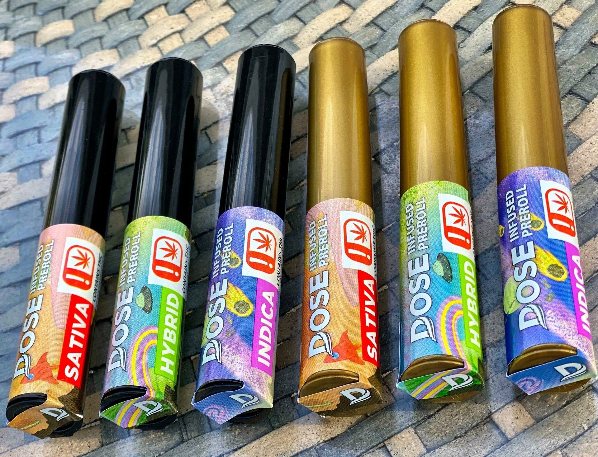 A group of tubes of eyeliner are sitting on top of a wicker table.