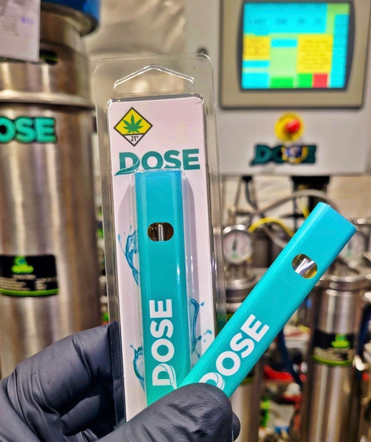 A person is holding a dose device in their hand