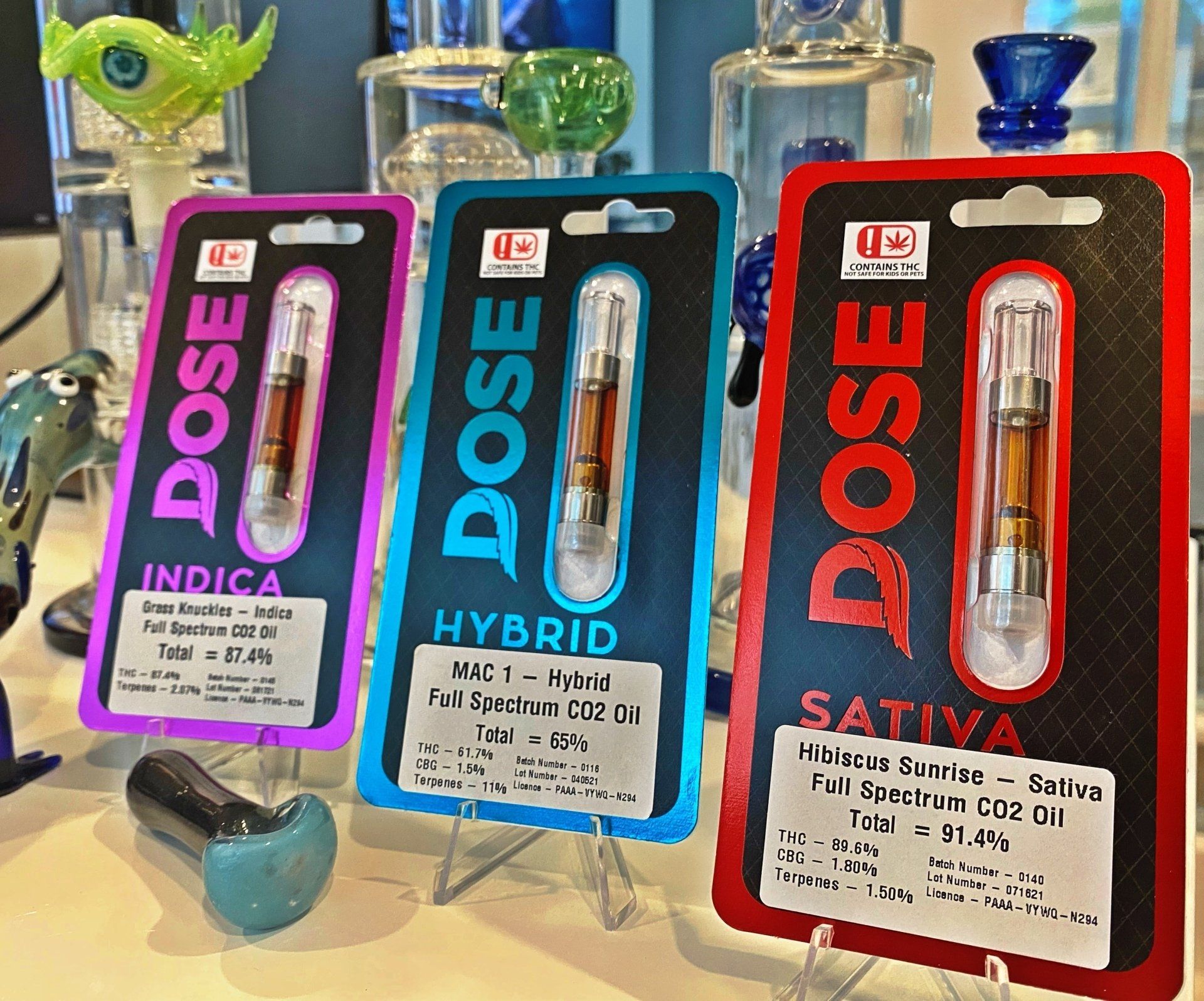 Three packages of dose sativa hybrid and indica cartridges