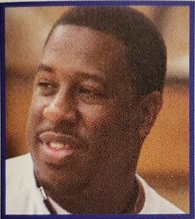 A close up of a man 's face with a purple frame around it