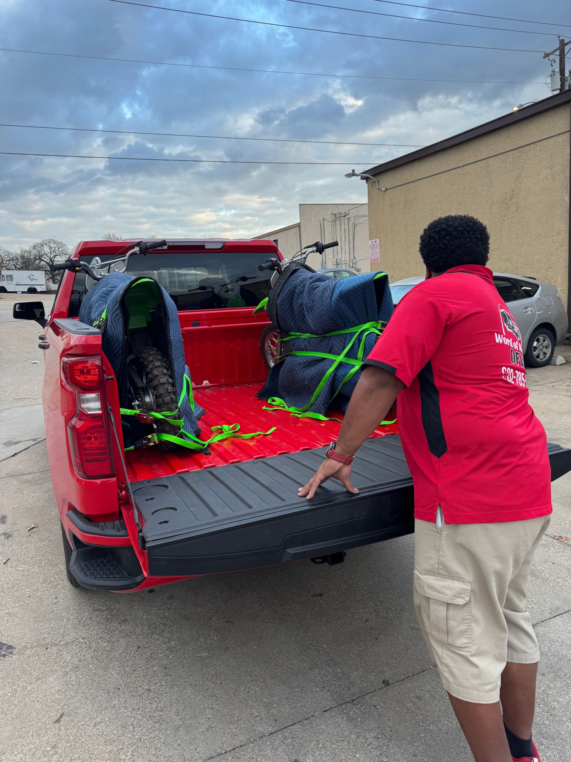 A hisense uhd 4k television is sitting in the back of a truck.