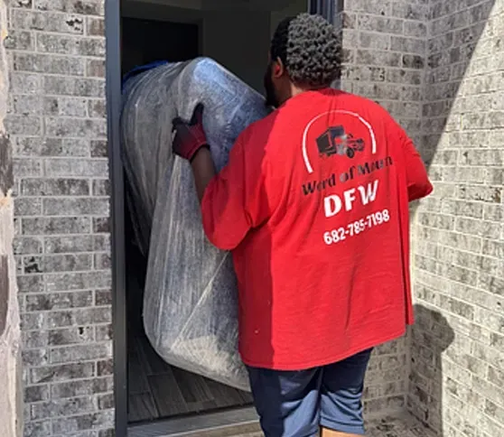 A man wearing a red shirt that says word of work on it