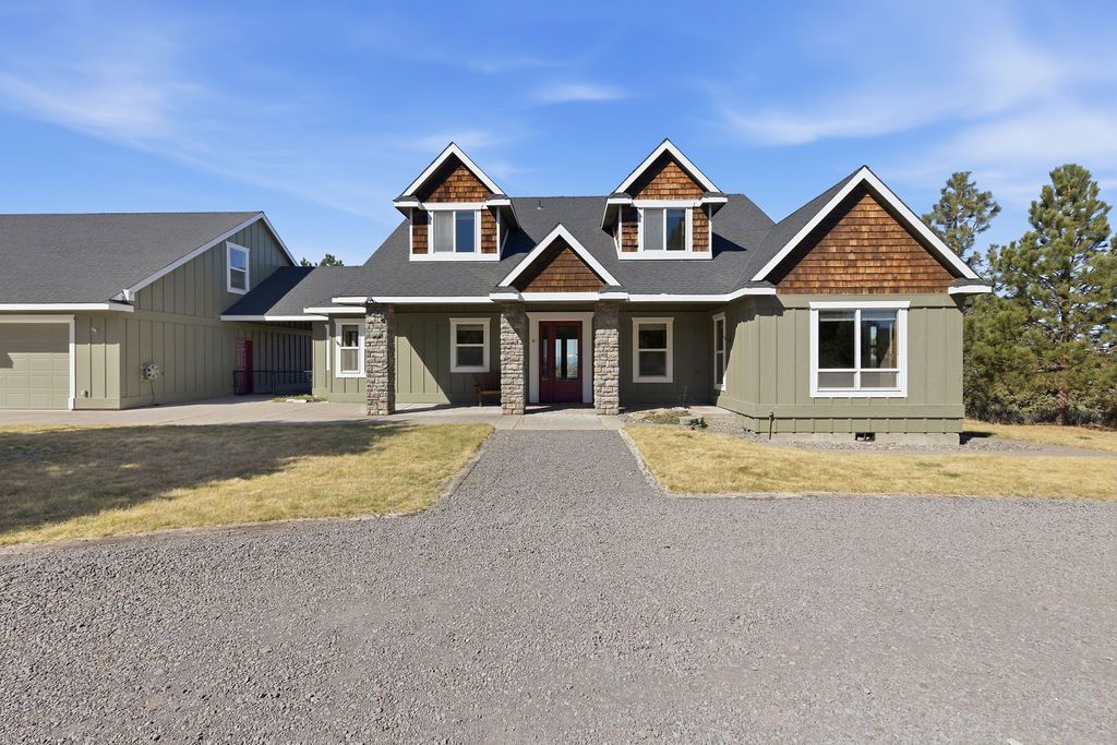 A view of a mountain through a window at sunset