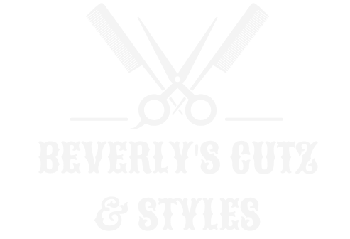 A pair of scissors and a razor are crossed over each other on a white background.