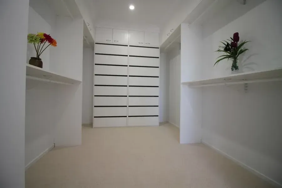 Empty White Walk-in Closet With Shelves  — JRB Joinery In Kew, NSW