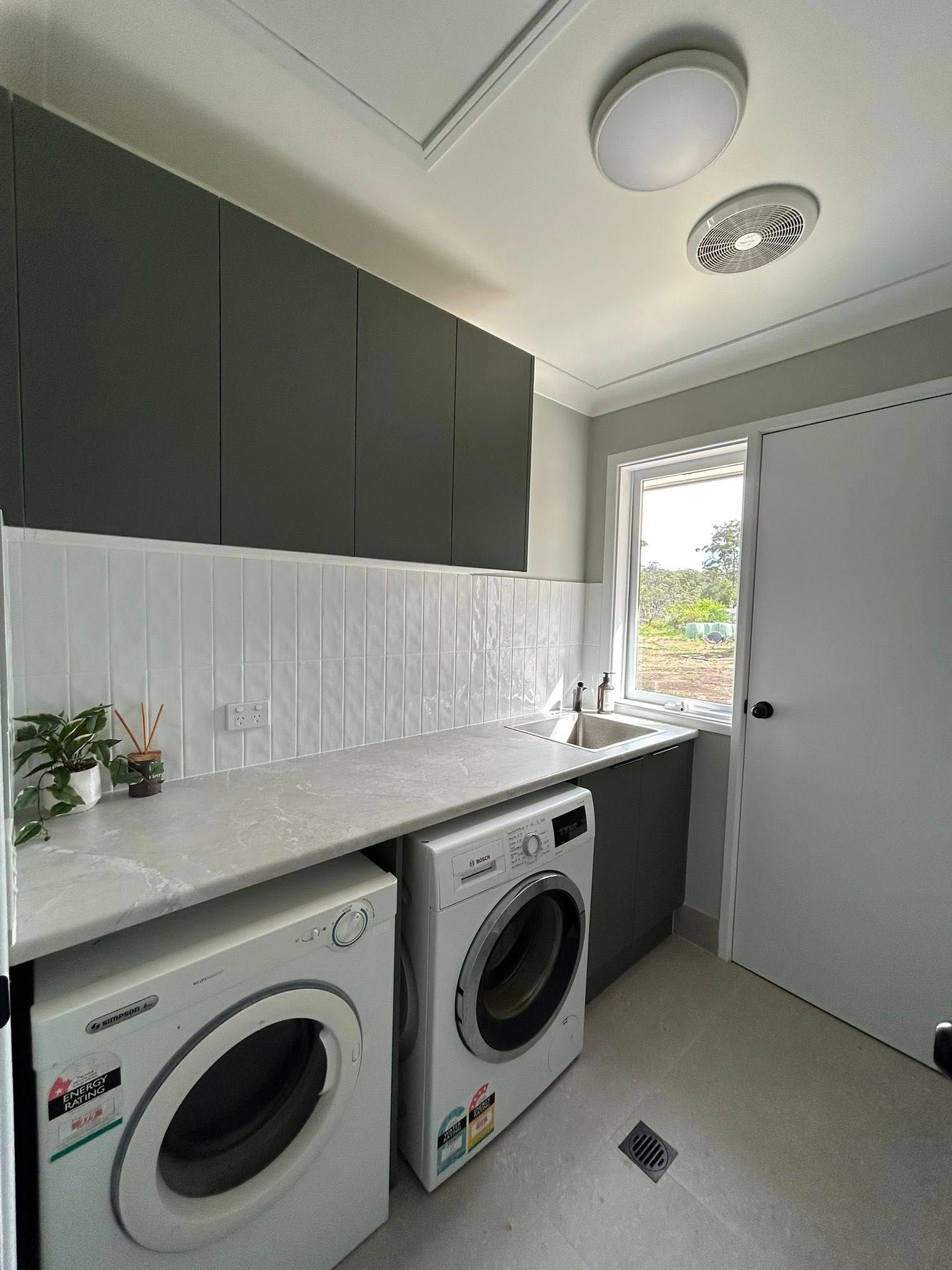 Laundry Room With Dark Grey Cabinets — JRB Joinery In Kew, NSW