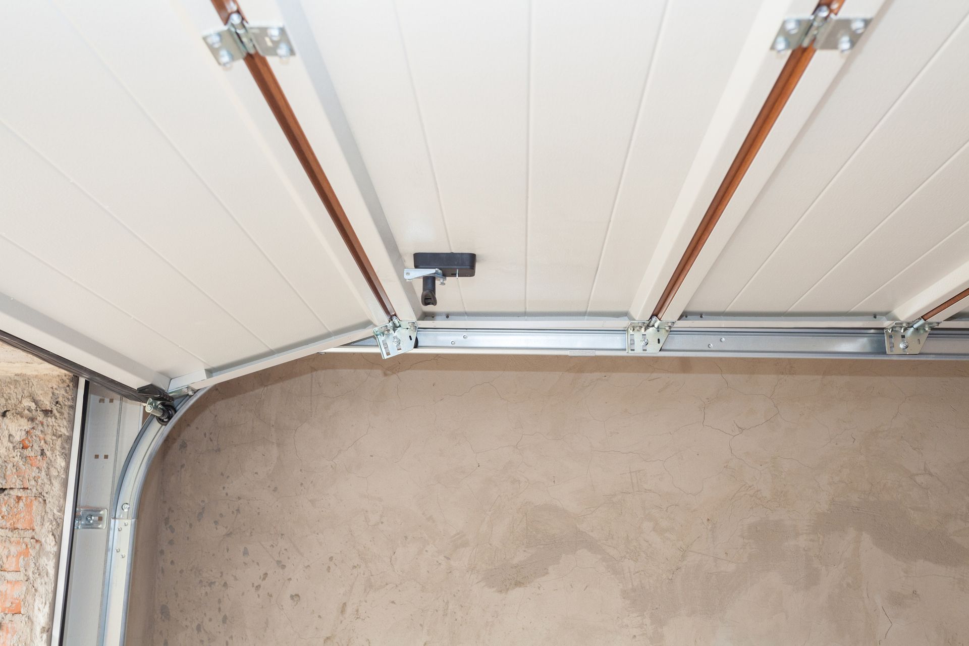 The inside of a garage door with the door open.