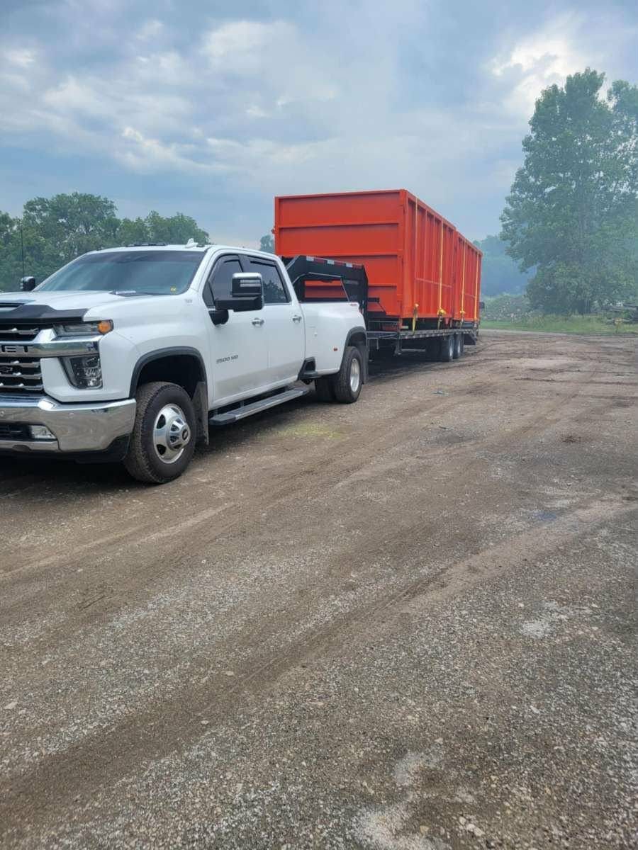 A large house is being demolished by a bulldozer.