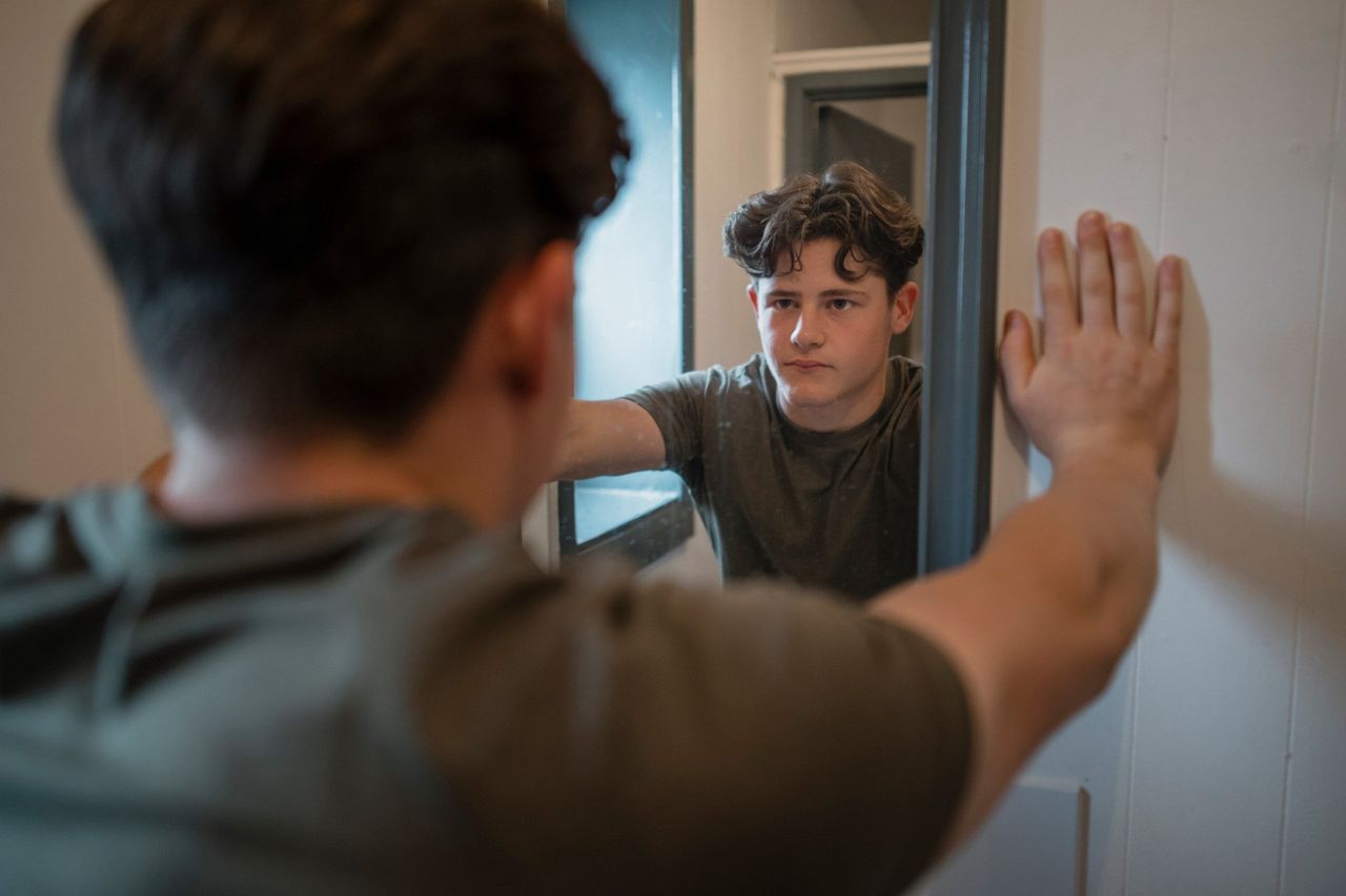Man Looking at the Mirror