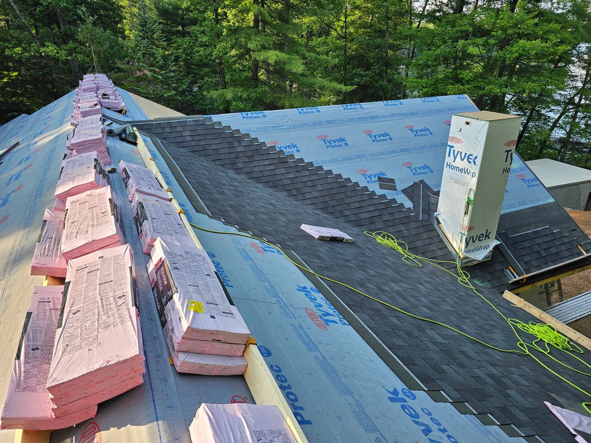 Skilled worker hands carefully arranging and securing roof tiles, creating a durable and precise roofing structure.